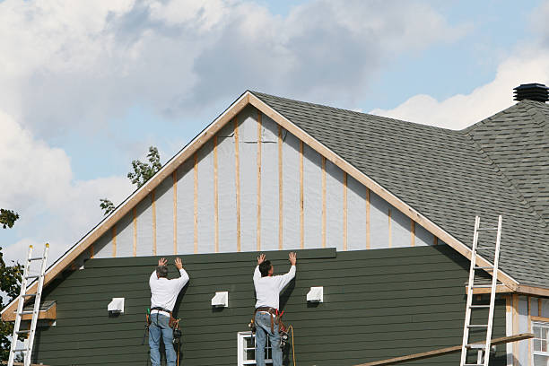 Professional Siding Installation technician working in Holmesville, OH